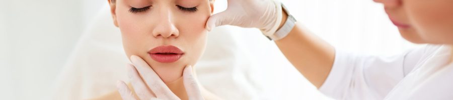 Crop,Cosmetologist,In,White,Gloves,Examining,Face,Skin,Of,Young